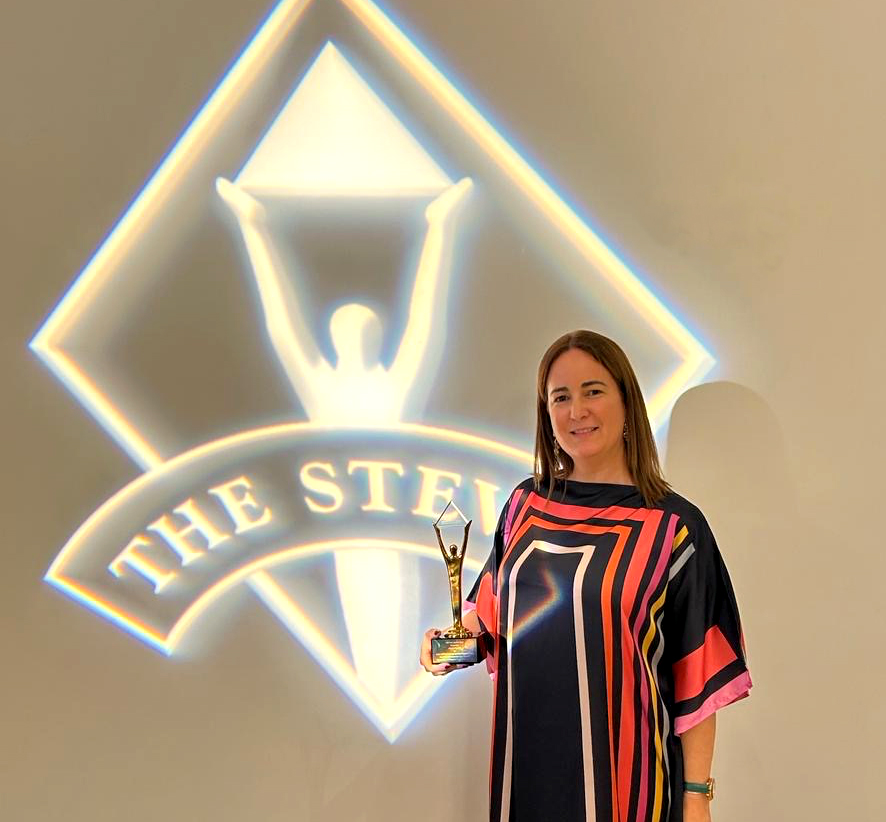 Image of Marian Merino receiving the Gold Stevie award for Innovative Achievement in Human Resources